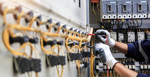 Professional Electrician technician working in East Patchogue, NY
